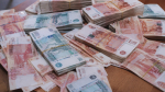 Много денег на столе / Фото: создано в нейросети ChatGPT